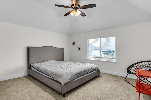 bedroom featuring carpet floors, baseboards, and lofted ceiling