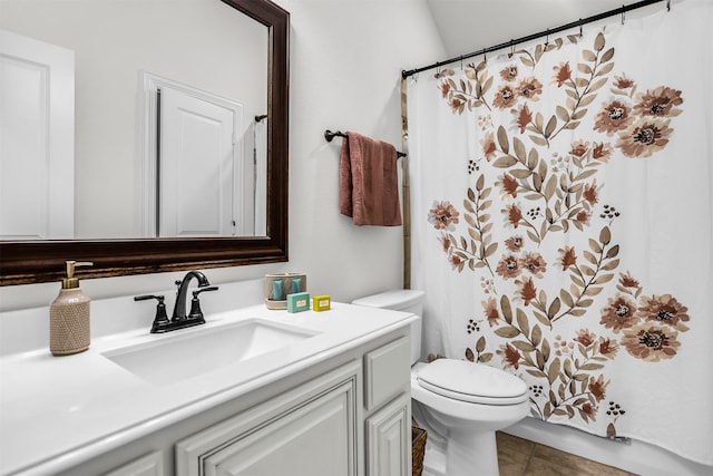 full bathroom featuring a shower with curtain, vanity, toilet, and tile patterned floors