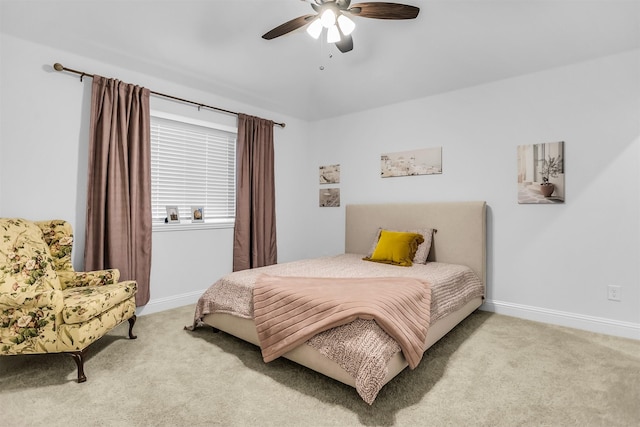 carpeted bedroom featuring ceiling fan and baseboards