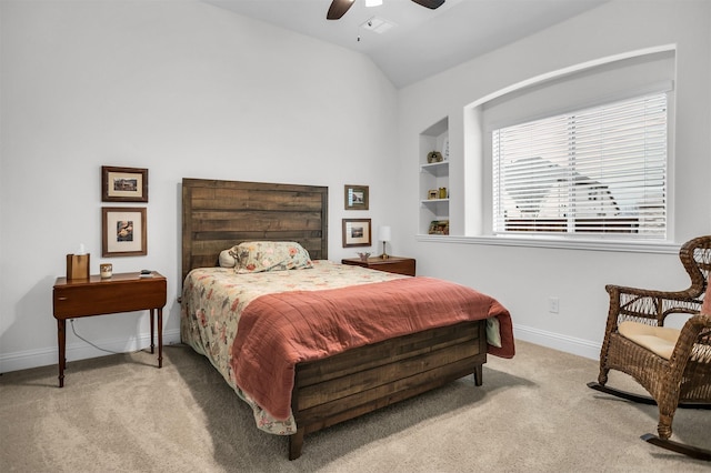 carpeted bedroom featuring vaulted ceiling, a ceiling fan, and baseboards