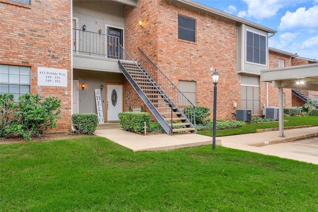 exterior space with central AC unit and stairway