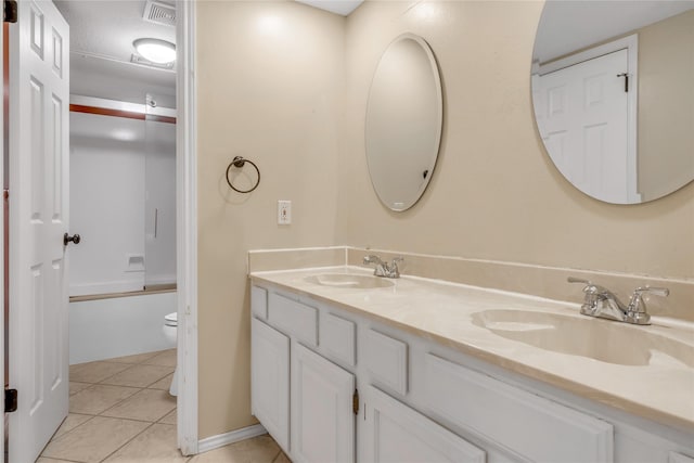 full bathroom with toilet, a sink, visible vents, and tile patterned floors