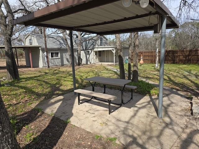 view of patio / terrace featuring fence