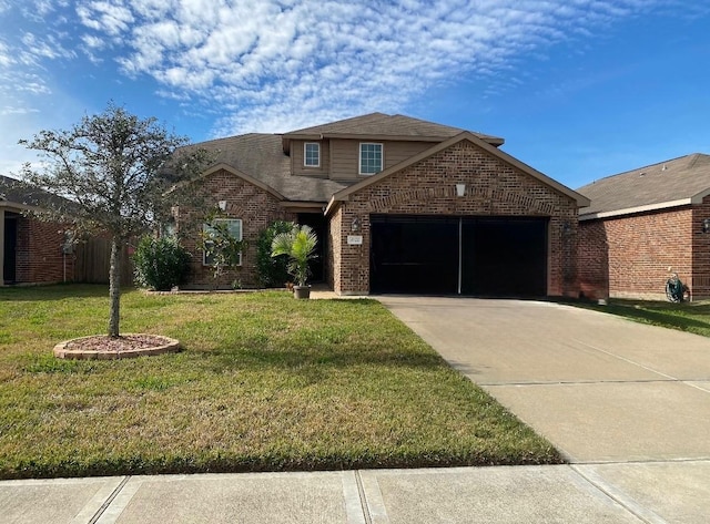 traditional-style house with a front yard, concrete driveway, brick siding, and an attached garage