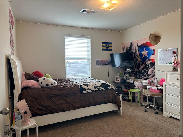 carpeted bedroom with visible vents