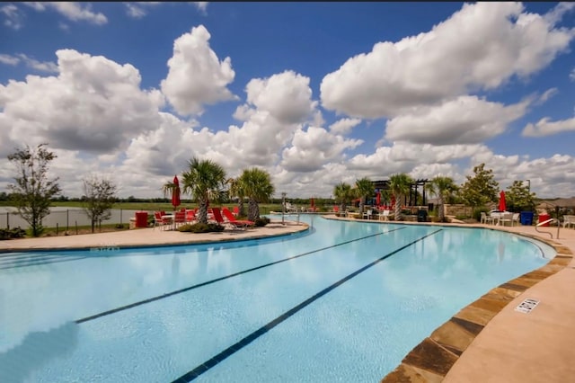 community pool featuring a patio area