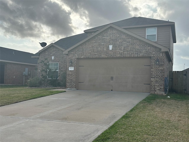 view of front of home with an attached garage, a front yard, concrete driveway, and brick siding