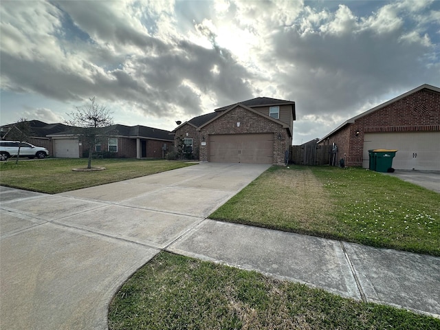 view of front of home with a garage, concrete driveway, fence, a front lawn, and brick siding