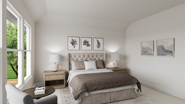 bedroom featuring lofted ceiling and baseboards