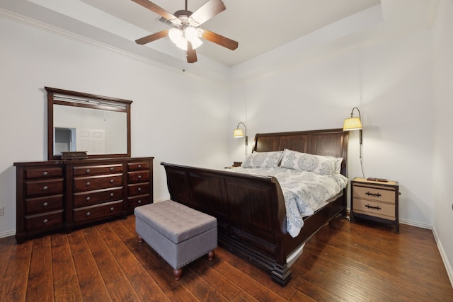 bedroom with a ceiling fan, baseboards, and hardwood / wood-style floors