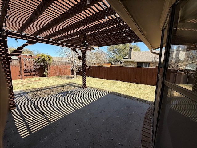 view of patio / terrace with a pergola and a fenced backyard