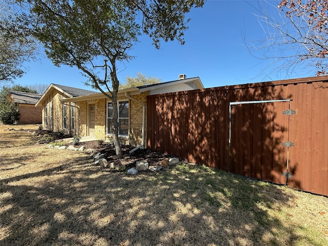 exterior space with brick siding