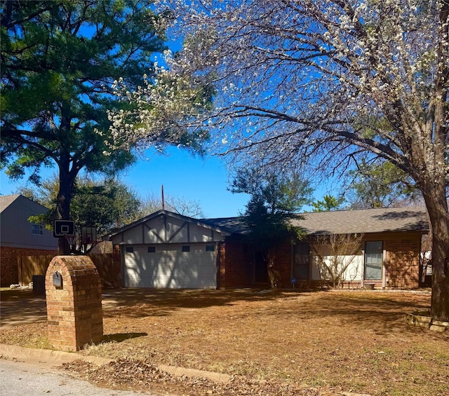 ranch-style home featuring a garage