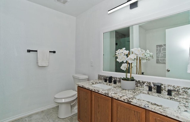 full bathroom with visible vents, a sink, toilet, and tile patterned floors