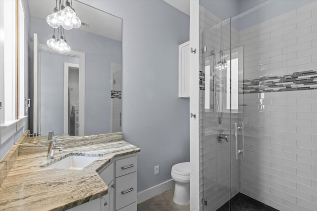 full bath featuring toilet, visible vents, vanity, baseboards, and a shower stall