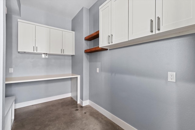 washroom featuring baseboards