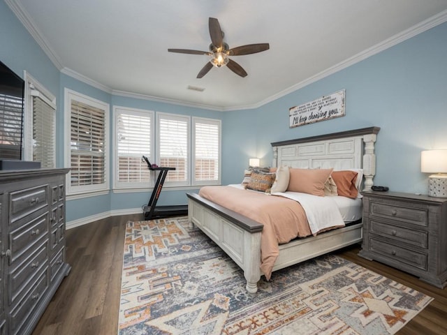 bedroom featuring dark wood-style flooring, visible vents, baseboards, a ceiling fan, and crown molding