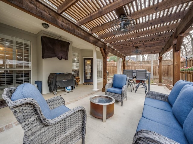 view of patio featuring an outdoor living space with a fire pit, ceiling fan, fence, a pergola, and outdoor dining space