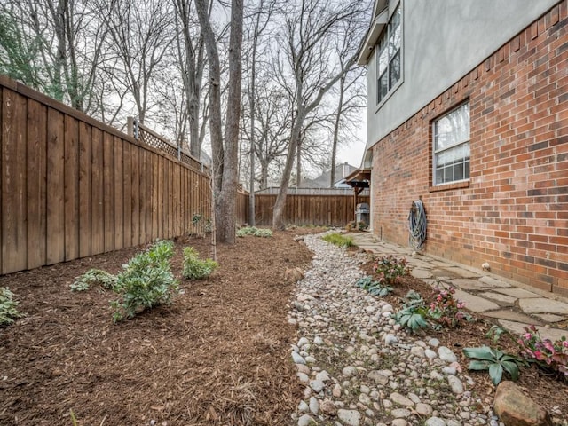 view of yard with a fenced backyard