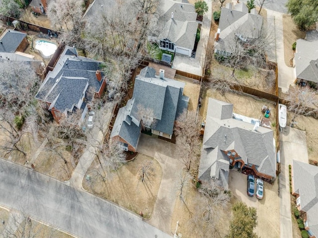 birds eye view of property with a residential view