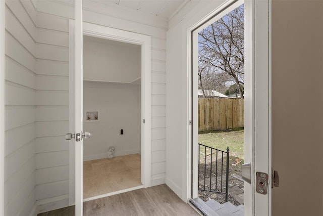 doorway to outside with french doors and wood finished floors