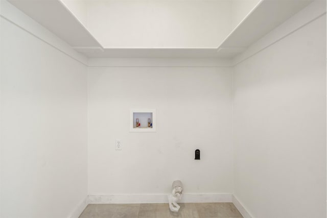 clothes washing area featuring laundry area, hookup for a washing machine, baseboards, and electric dryer hookup