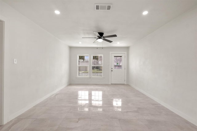 spare room featuring recessed lighting, visible vents, ceiling fan, and baseboards