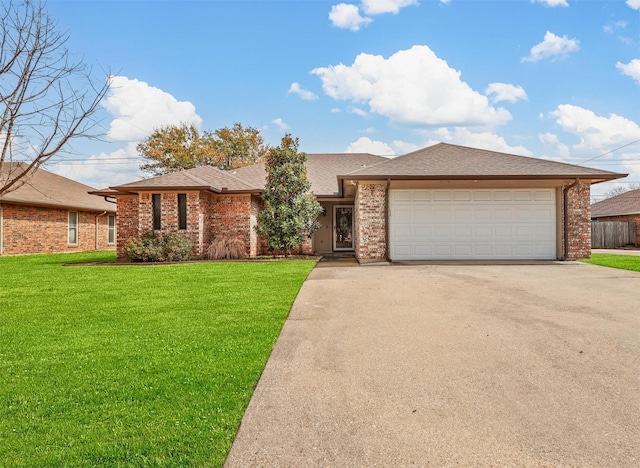 view of front of property featuring brick siding, a shingled roof, an attached garage, a front yard, and driveway