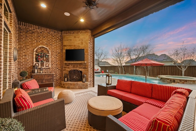 view of patio featuring a fenced in pool, a fenced backyard, an outdoor living space with a fireplace, and an in ground hot tub