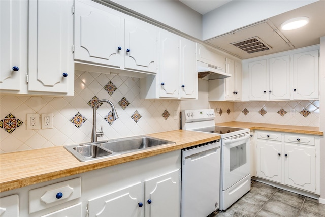 kitchen featuring white appliances, visible vents, under cabinet range hood, white cabinetry, and a sink