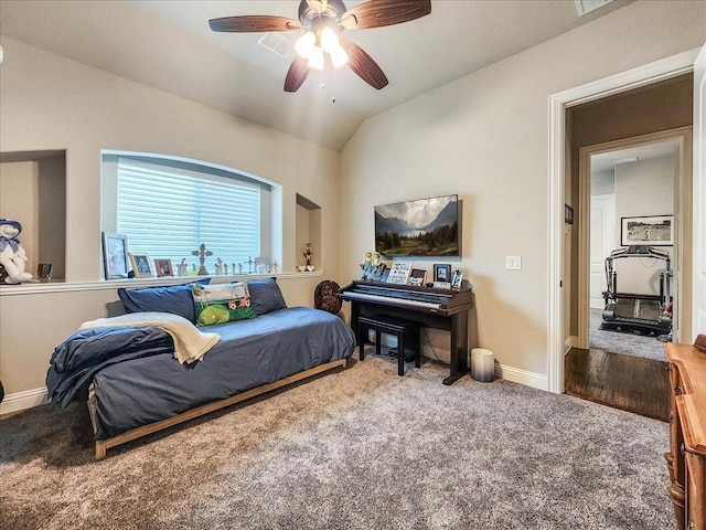 bedroom with carpet floors, ceiling fan, baseboards, and vaulted ceiling