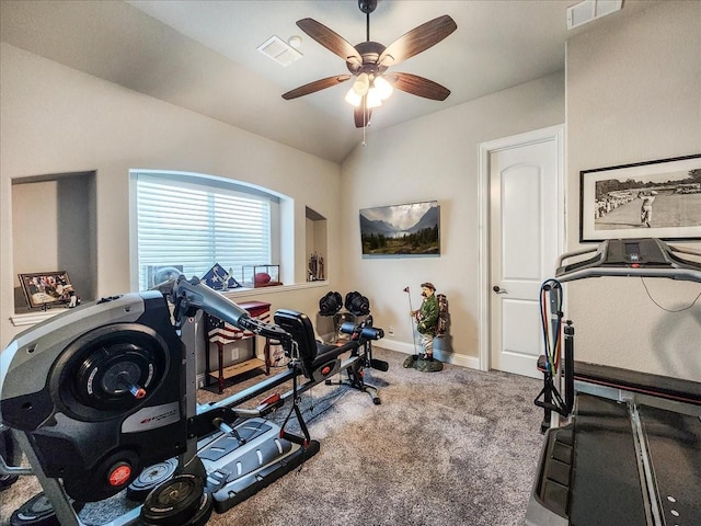 workout room featuring baseboards, visible vents, vaulted ceiling, and carpet flooring