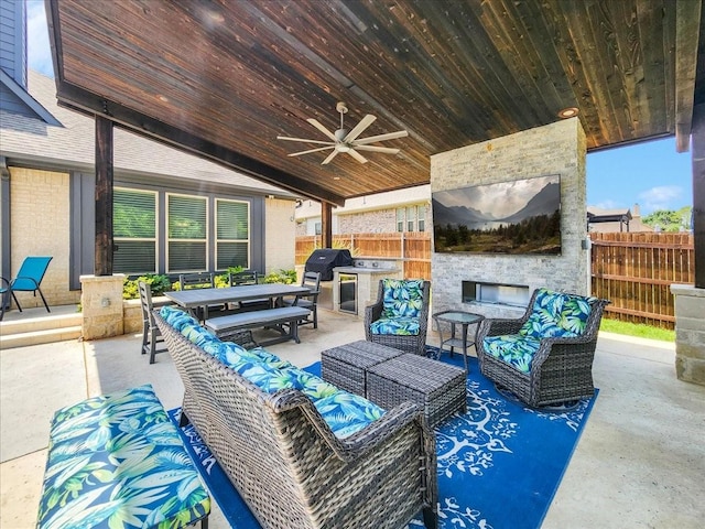 view of patio with ceiling fan, outdoor lounge area, fence, and a grill