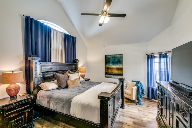 bedroom with light wood-type flooring, lofted ceiling, and ceiling fan