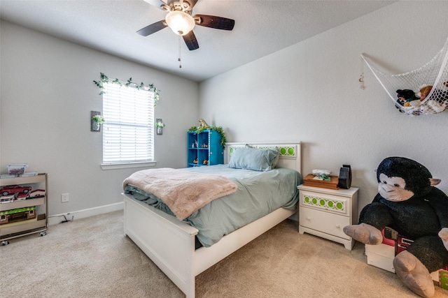 bedroom featuring carpet, ceiling fan, and baseboards