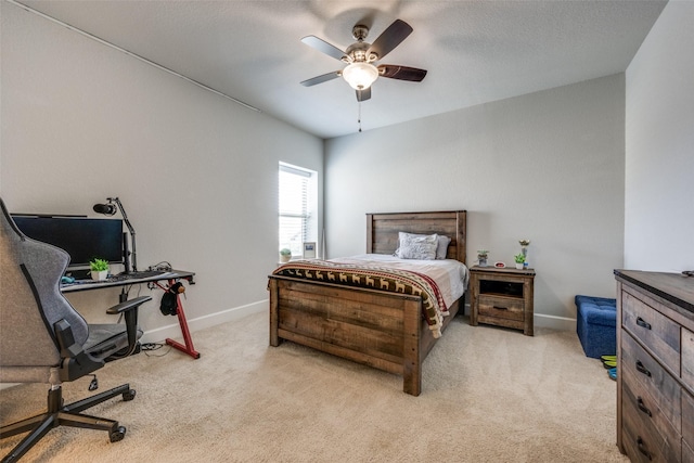 bedroom featuring carpet flooring, ceiling fan, a textured ceiling, and baseboards