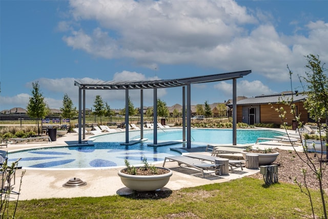 pool with a patio area and fence