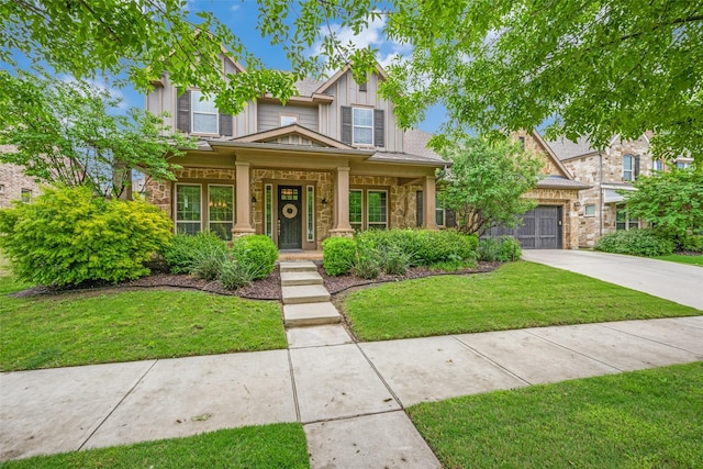 craftsman-style home featuring driveway, stone siding, covered porch, an attached garage, and a front lawn