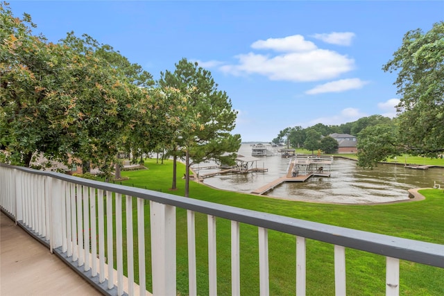 balcony with a water view and a boat dock