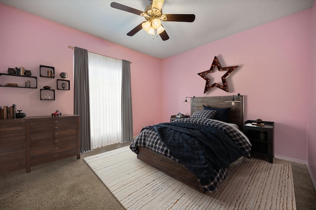 carpeted bedroom with a ceiling fan