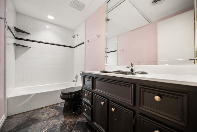 bathroom featuring visible vents, toilet, washtub / shower combination, vanity, and a textured ceiling