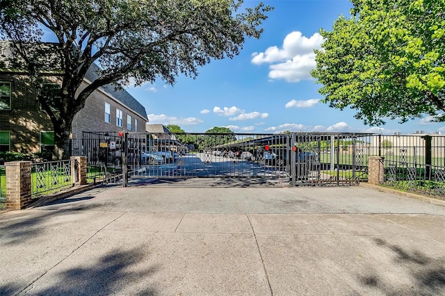 view of gate featuring fence