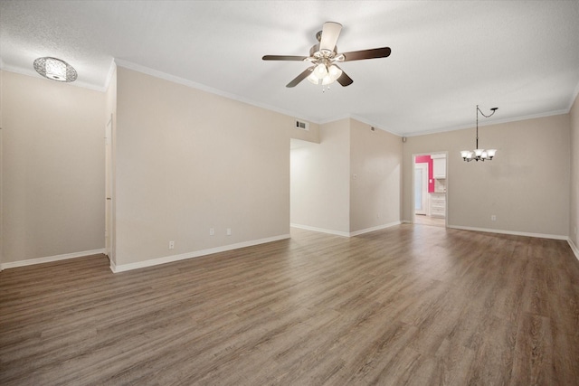 unfurnished living room featuring baseboards, visible vents, wood finished floors, and ceiling fan with notable chandelier