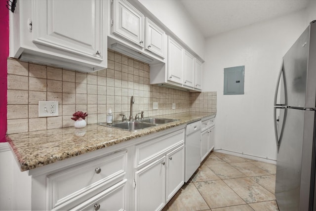 kitchen with freestanding refrigerator, white cabinets, a sink, electric panel, and dishwasher