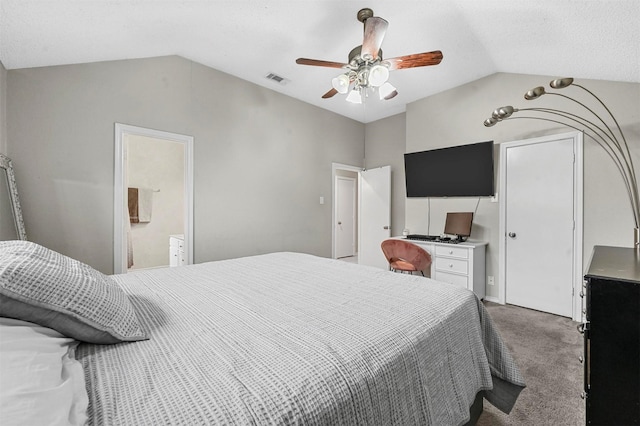 carpeted bedroom featuring visible vents, vaulted ceiling, and ceiling fan