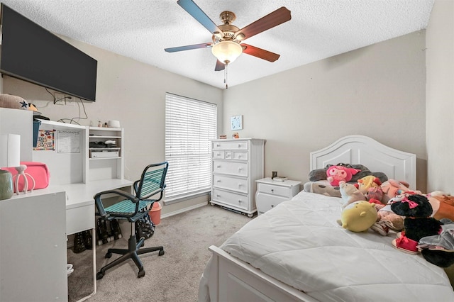 bedroom featuring a ceiling fan, a textured ceiling, and light colored carpet