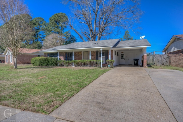 single story home with an attached carport, brick siding, fence, driveway, and a front lawn