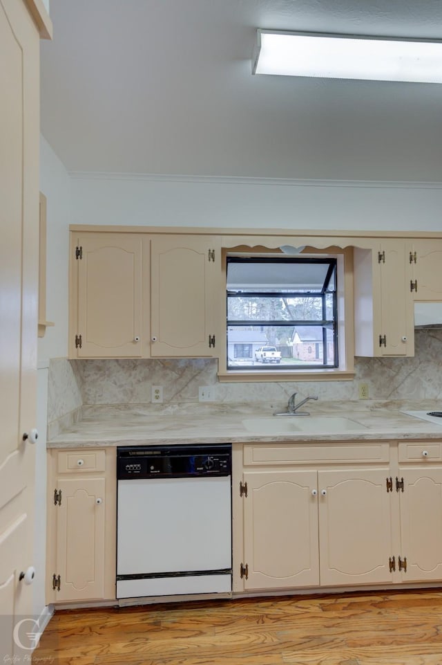 kitchen featuring extractor fan, backsplash, white dishwasher, and a sink