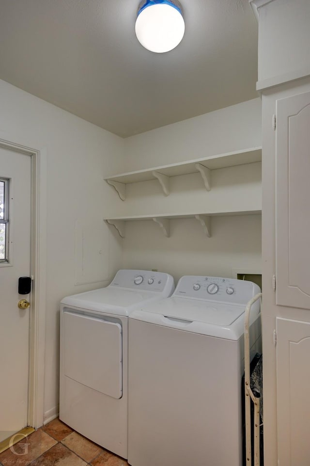 clothes washing area featuring laundry area and washing machine and clothes dryer