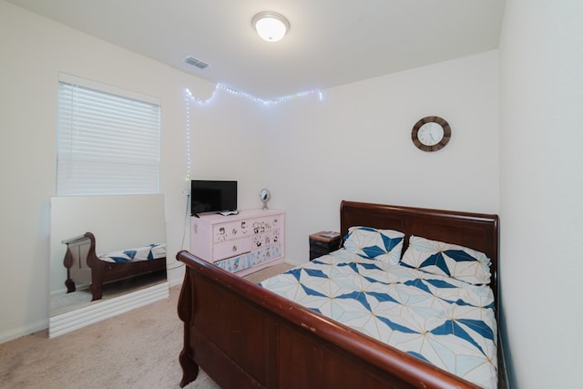 bedroom with carpet floors and visible vents